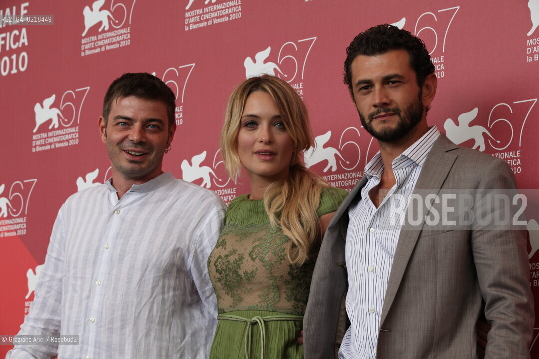 67th Venice International Film Festival - Venice September 5, 2010 - Photocall of the film 20 sigarette -  Left to right: director Aureliano Amadei, actress Carolina Crescentini and actor Vinicio Marchioni
