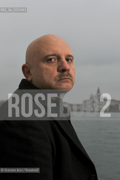 Venice 14/1/11 - The writer Tiziano Scarpa with the Italian national flag. He fought against the racism for an interracial country and now, in the 150 years centennial of italian Unity,  the tricolored flag is his fight flag. ©Graziano Arici/Rosebud2