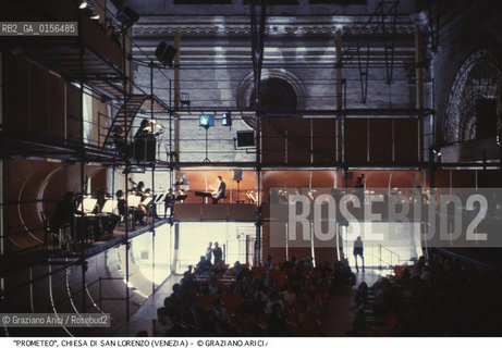 -Venezia,1984.Chiesa di San Lorenzo. Opera del compositore contemporaneo Luigi Nono, Prometeo - Tragedia dellascolto prova generale, testo di Massimo Cacciari, struttura scenica dellarchitetto Renzo Piano, luci del pittore Emilio Vedova.Il compositore Luigi Nono durante le prove. musica compositore opera Prometeo contemporanea elettronica filosofia architettura pittura ritratto.-Venice,1984. Work  Prometeo - Tragedia dellascolto directed by contemporary composer Luigi Nono,text by the philosopher Massimo Cacciari,scenography by the architect Renzo Piano,stage lighting by the painter Emilio Vedova. Portrait of the composer Luigi Nono ©Graziano Arici/Rosebud2