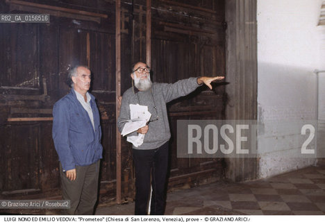 -Venezia,1984.Chiesa di San Lorenzo. Opera del compositore contemporaneo Luigi Nono, Prometeo - Tragedia dellascolto prova generale, testo di Massimo Cacciari, struttura scenica dellarchitetto Renzo Piano, luci del pittore Emilio Vedova.Il compositore Luigi Nono durante le prove con il pittore Emilio Vedova. musica compositore opera Prometeo contemporanea elettronica filosofia architettura pittura ritratto.-Venice,1984. Work  Prometeo - Tragedia dellascolto directed by contemporary composer Luigi Nono,text by the philosopher Massimo Cacciari,scenography by the architect Renzo Piano,stage lighting by the painter Emilio Vedova. Portrait of the composer Luigi Nono with the painter Emilio Vedova ©Graziano Arici/Rosebud2