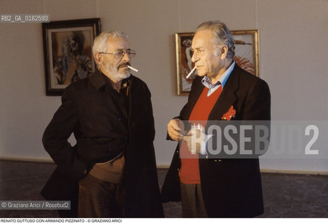 Caption: Nome: .GUTTUSO RENATO.Descrizione: .ARTE PITTORE / FUMA SIGARETTA CON  ARMANDO PIZZINATO.Credit: ©Graziano Arici/Rosebud2 / Costo: .A.Nazione: .ITALIA.Cittˆ: ..Data: .1982
