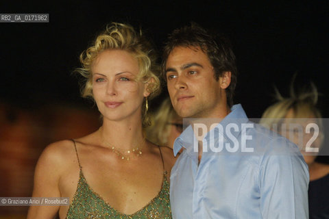 01/09 - VENICE - 58.INTERNATIONAL FILM FESTIVAL - THE ACTRESS  CHARLIZE THERON WITH HER BOYFRIEND - THE CURSE OF THE JADE SCORPION - ©Graziano Arici/Rosebud2