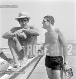 THE POP SINGER ADRIANO CELENTANO AND THE POP SINGER NINO SANTERCOLE AT VENICE LIDO BEACH  - 1962 © ARCHIVIO Graziano Arici/Rosebud2  /  MUSICA POP / CANTANTE POP / SPIAGGIA