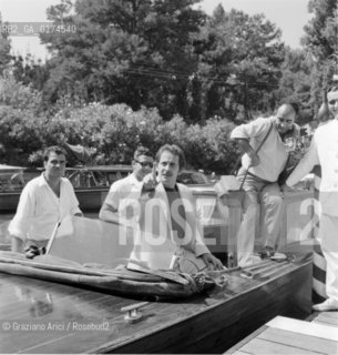 THE POP SINGER DOMENICO MODUGNO AT THE XXV INTERNATIONAL FILM FESTIVAL IN VENICE LIDO  - 1964 © ARCHIVIO Graziano Arici/Rosebud2  /  MUSICA POP / CANTANTE POP / FOTOGRAFO / MOSTRA DEL CINEMA / MOTOSCAFO