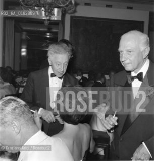 THE PIANIST ARTHUR RUBINSTEIN WITH DON CARLOS DE BESTEGUI AT  JOURNALIST ELSA MAXWELLS PARTY   - 1957  © ARCHIVIO Graziano Arici/Rosebud2  / MUSICA / PIANISTA / NOBILTA
