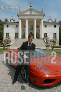 CROCETTA DEL MONTELLO (TREVISO) IL PRESIDENTE DELLA FABBRICA DI SCARPE GEOX MARIO MORETTI POLEGATO A CASA IN VILLA SANDI CON UNA DELLE SUE DUE FERRARI, UNA FERRARI MODENA PRESIDENT OF SHOES FACTORY GEOX HOME ©Graziano Arici/Rosebud2 SCARPA INDUSTRIALE ECONOMIA AUTOMOBILE
