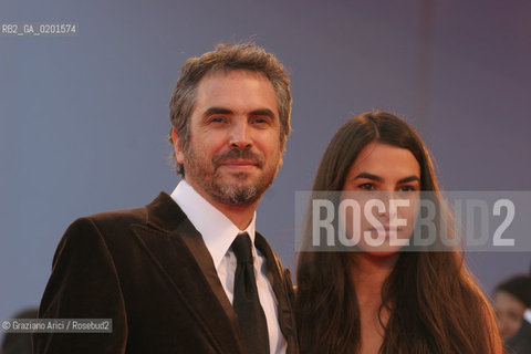 09_9_06 - 63 VENICE FILM FESTIVAL - RED CARPET OFFICIAL AWARDS - THE DIRECTOR ALFONSO CUARON WITH HIS WIFE ©Graziano Arici/Rosebud2