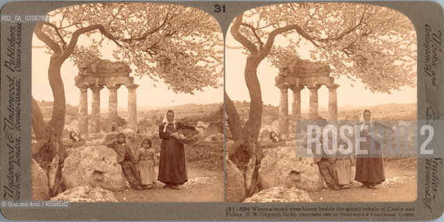 -VENEZIA, UNDERWOOD & UNDERWOOD PUBBLISHERS WORKS AND STUDIOS - WASHINGTON D.C. - ARLINGTON - LITTLETON, TREES BLOOM BESIDE THE TEMPLE OF CASTOR AND POLLUX, 1906 C.A. POSITIVO ALLALBUMINA MONTATO SU CARTONE, FOTOGRAFIA STEREOSCOPICA, CM 17,8X8,8  ©ARCHIVIO Graziano Arici/Rosebud2   AGRIGENTO, SICILIA, ALBERO FIORITO E TEMPIO, PERSONA, FOTOANTICHE.-VENICE, UNDERWOOD & UNDERWOOD PUBBLISHERS WORKS AND STUDIOS - WASHINGTON D.C. - ARLINGTON - LITTLETON, , 1906 C.A. ALBUMEN POSITIVE MOUNTED ON CARDBOARD, STEREOSCOPICAL PHOTOGRAPH CM 17,8X8,8 ©Graziano Arici / rosebud2