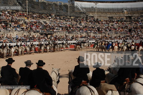 ARLES (FRANCE, PROVENCE) 1 MAY 2008 - 1 MAY HOLIDAY - FETE DES GARDIANS - HOLIDAY OF THE CAMARGUE CATTLE FARMER AND ELECTION OF ARLES QUEEN ROMAN ARENA ©Graziano Arici/Rosebud2 CAVALLO FESTA DEI GARDIANS COSTUME MAGGIO GIOIELLO PROVENZA CAPPELLO BAMBINO COURSE CAMARGUESE TORO GEO