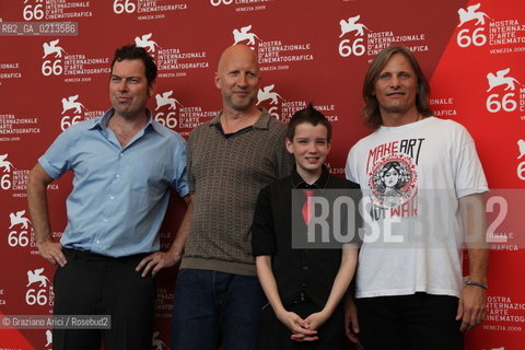 Italy, Venice - September 03, 2009.66th VENICE INTERNATIONAL FILM FESTIVAL - FILM: THE ROAD. LEFT TO RIGHT: THE SCREENWRITER JOE PENHALL, THE DIRECTOR JOHN HILLCOAT, ACTORS KODI SMIT-McPHEE AND VIGGO MORTENSEN