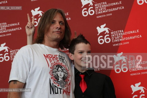 Italy, Venice - September 03, 2009.66th VENICE INTERNATIONAL FILM FESTIVAL - FILM: THE ROAD. ACTORS VIGGO MORTENSEN (T-SHIRT) AND KODI SMIT-McPHEE