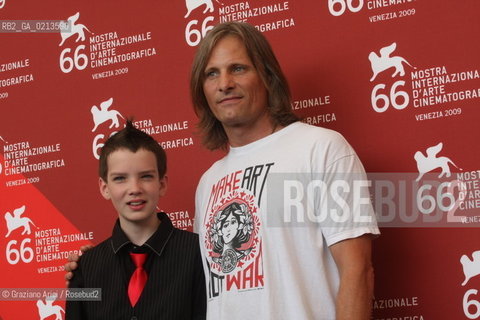 Italy, Venice - September 03, 2009.66th VENICE INTERNATIONAL FILM FESTIVAL - FILM: THE ROAD. ACTORS VIGGO MORTENSEN (T-SHIRT) AND KODI SMIT-McPHEE