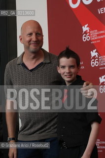 Italy, Venice - September 03, 2009.66th VENICE INTERNATIONAL FILM FESTIVAL - FILM: THE ROAD. THE DIRECTOR JOHN HILLCOAT WITH THE ACTOR KODI SMIT-McPHEE