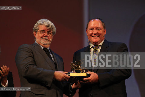 Italy, Venice - September 06th, 2009 66th VENICE INTERNATIONAL FILM FESTIVAL - THE DIRECTOR GEORGE LUCAS HAND IN THE GOLDEN LION TO JOHN LASSETER. GOLDEN LION FOR LIFETIME ACHIEVEMENT TO JOHN LASSETER AND THE PIXAR DIRECTORS.