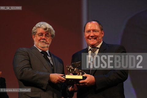 Italy, Venice - September 06th, 2009.66th VENICE INTERNATIONAL FILM FESTIVAL - THE DIRECTOR GEORGE LUCAS HAND IN THE GOLDEN LION TO JOHN LASSETER..GOLDEN LION FOR LIFETIME ACHIEVEMENT TO JOHN LASSETER AND THE PIXAR DIRECTORS.