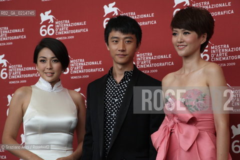 Italy, Venice - September 12th, 2009.66th VENICE INTERNATIONAL FILM FESTIVAL - FILM: CHENGDU, WO AI NI (CHENGDU, I LOVE YOU). THE ACTOR HUANG XUAN BETWEEN WU ANYA (LEFT) AND TAN WEIWEI.. ©Graziano Arici/Rosebud2