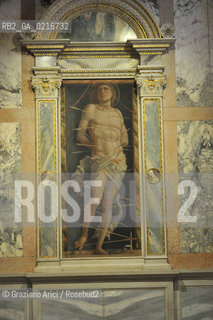 Venice - 12/7/10 - Cà dOro Museum : Wooden grate in front of  St. Sebastian by Andrea Mantegna. The wooden grate was put by an architect follower of Carlo Scarpa. Museo grata sebastiano ©Graziano Arici/Rosebud2