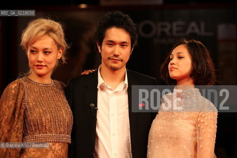 67th Venice International Film Festival - Venice September 2, 2010 - Red Carpet of the film Noruwei No Mori (Norvegian Wood) - The actor Kenichi Matsuyama between  the actresses Rinko Kikuchi (left) and Kiko Mizuhara