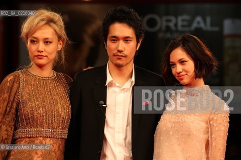 67th Venice International Film Festival - Venice September 2, 2010 - Red Carpet of the film Noruwei No Mori (Norvegian Wood) - The actor Kenichi Matsuyama between  the actresses Rinko Kikuchi (left) and Kiko Mizuhara