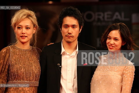 67th Venice International Film Festival - Venice September 2, 2010 - Red Carpet of the film Noruwei No Mori (Norvegian Wood) - The actor Kenichi Matsuyama between  the actresses Rinko Kikuchi (left) and Kiko Mizuhara