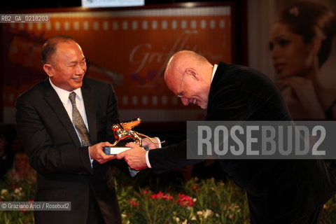 67th Venice International Film Festival - Venice September 3, 2010 - Red Carpet of the film Jianyu (Reign of Assassins) And The Golden Lion For Lifetime Achievement to John Woo. The director John Woo with the Lion