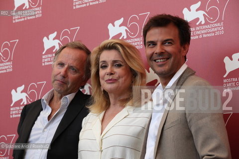 67th Venice International Film Festival - Venice September 4, 2010 - Photocall of the film Potiche - The director Francois Ozon (right) with the actor Fabrice Luchini and actress Catherine Deneuve