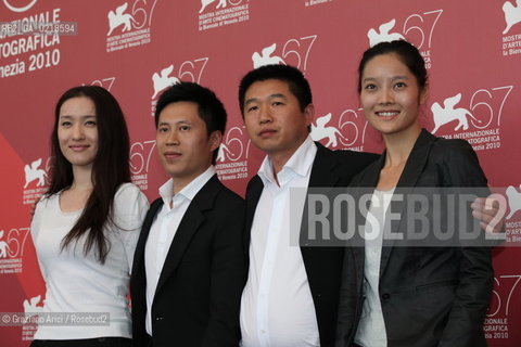 67th Venice International Film Festival - Venice September 5, 2010 - Photocall of the film Le Fossè (The Ditch) - Left to right: The actress Tian Xiaou, the actor Lu Ye, the director Wang Bing, the actress  Xu Cenzi