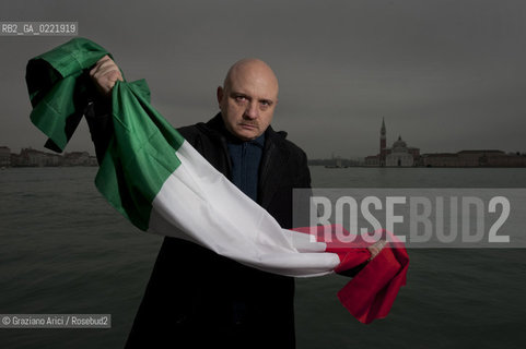 Venice 14/1/11 - The writer Tiziano Scarpa with the Italian national flag. He fought against the racism for an interracial country and now, in the 150 years centennial of italian Unity,  the tricolored flag is his fight flag. ©Graziano Arici/Rosebud2