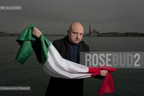 Venice 14/1/11 - The writer Tiziano Scarpa with the Italian national flag. He fought against the racism for an interracial country and now, in the 150 years centennial of italian Unity,  the tricolored flag is his fight flag. ©Graziano Arici/Rosebud2