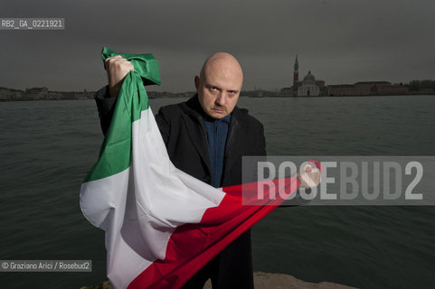 Venice 14/1/11 - The writer Tiziano Scarpa with the Italian national flag. He fought against the racism for an interracial country and now, in the 150 years centennial of italian Unity,  the tricolored flag is his fight flag. ©Graziano Arici/Rosebud2