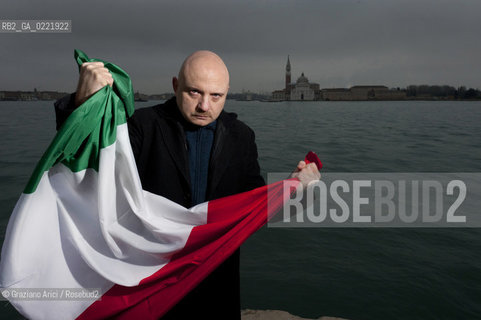 Venice 14/1/11 - The writer Tiziano Scarpa with the Italian national flag. He fought against the racism for an interracial country and now, in the 150 years centennial of italian Unity,  the tricolored flag is his fight flag. ©Graziano Arici/Rosebud2
