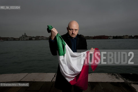 Venice 14/1/11 - The writer Tiziano Scarpa with the Italian national flag. He fought against the racism for an interracial country and now, in the 150 years centennial of italian Unity,  the tricolored flag is his fight flag. ©Graziano Arici/Rosebud2