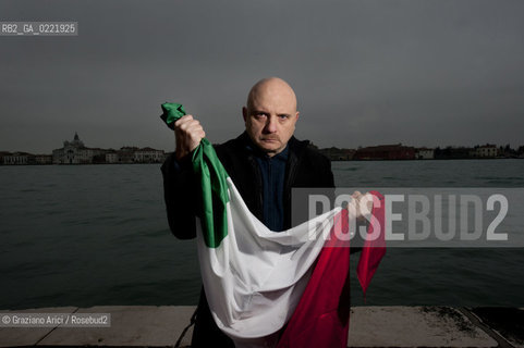 Venice 14/1/11 - The writer Tiziano Scarpa with the Italian national flag. He fought against the racism for an interracial country and now, in the 150 years centennial of italian Unity,  the tricolored flag is his fight flag. ©Graziano Arici/Rosebud2