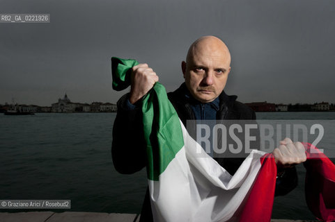 Venice 14/1/11 - The writer Tiziano Scarpa with the Italian national flag. He fought against the racism for an interracial country and now, in the 150 years centennial of italian Unity,  the tricolored flag is his fight flag. ©Graziano Arici/Rosebud2