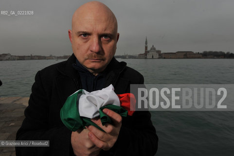 Venice 14/1/11 - The writer Tiziano Scarpa with the Italian national flag. He fought against the racism for an interracial country and now, in the 150 years centennial of italian Unity,  the tricolored flag is his fight flag. ©Graziano Arici/Rosebud2