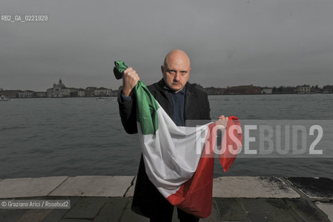 Venice 14/1/11 - The writer Tiziano Scarpa with the Italian national flag. He fought against the racism for an interracial country and now, in the 150 years centennial of italian Unity,  the tricolored flag is his fight flag. ©Graziano Arici/Rosebud2