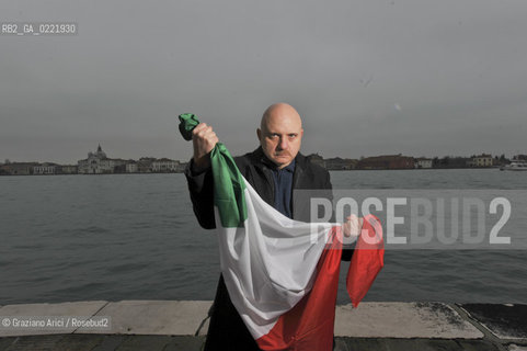 Venice 14/1/11 - The writer Tiziano Scarpa with the Italian national flag. He fought against the racism for an interracial country and now, in the 150 years centennial of italian Unity,  the tricolored flag is his fight flag. ©Graziano Arici/Rosebud2