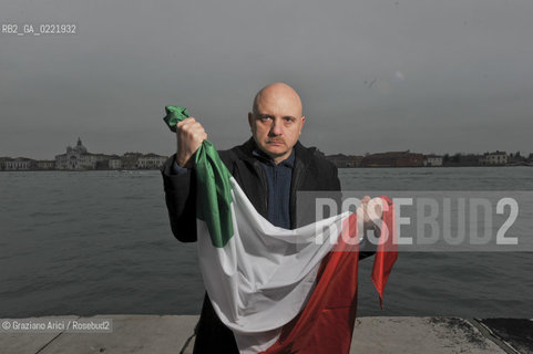 Venice 14/1/11 - The writer Tiziano Scarpa with the Italian national flag. He fought against the racism for an interracial country and now, in the 150 years centennial of italian Unity,  the tricolored flag is his fight flag. ©Graziano Arici/Rosebud2