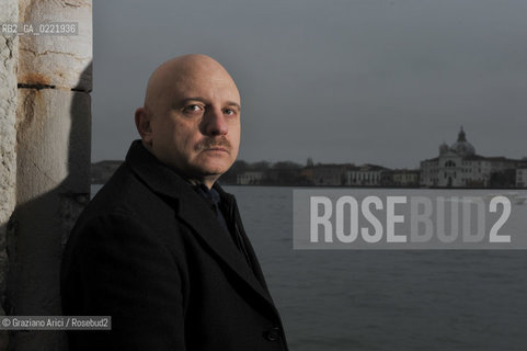 Venice 14/1/11 - The writer Tiziano Scarpa with the Italian national flag. He fought against the racism for an interracial country and now, in the 150 years centennial of italian Unity,  the tricolored flag is his fight flag. ©Graziano Arici/Rosebud2
