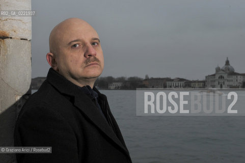 Venice 14/1/11 - The writer Tiziano Scarpa with the Italian national flag. He fought against the racism for an interracial country and now, in the 150 years centennial of italian Unity,  the tricolored flag is his fight flag. ©Graziano Arici/Rosebud2