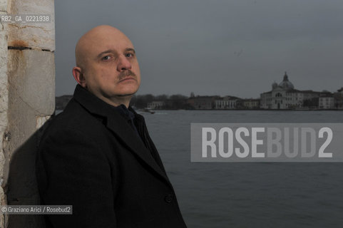 Venice 14/1/11 - The writer Tiziano Scarpa with the Italian national flag. He fought against the racism for an interracial country and now, in the 150 years centennial of italian Unity,  the tricolored flag is his fight flag. ©Graziano Arici/Rosebud2