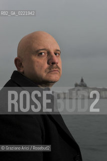 Venice 14/1/11 - The writer Tiziano Scarpa with the Italian national flag. He fought against the racism for an interracial country and now, in the 150 years centennial of italian Unity,  the tricolored flag is his fight flag. ©Graziano Arici/Rosebud2
