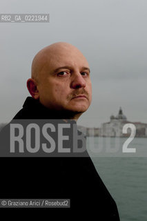 Venice 14/1/11 - The writer Tiziano Scarpa with the Italian national flag. He fought against the racism for an interracial country and now, in the 150 years centennial of italian Unity,  the tricolored flag is his fight flag. ©Graziano Arici/Rosebud2