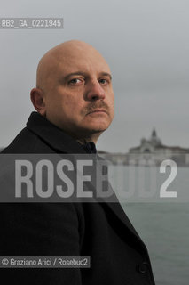 Venice 14/1/11 - The writer Tiziano Scarpa with the Italian national flag. He fought against the racism for an interracial country and now, in the 150 years centennial of italian Unity,  the tricolored flag is his fight flag. ©Graziano Arici/Rosebud2