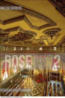 Caption: Nome:..SCUOLA GRANDE SPAGNOLA : SCUOLA GRANDE SPAGNOLA : INTERNO VERSO LARON (ARCA SANTA) DAL MATRONEO..     ..Localizzazione:..VENEZIA / CANNAREGIO / GHETTO VECCHIO / SINAGOGA / SCUOLA GRANDE SPAGNOLA   ..VENICE / CANNAREGIO /  GHETTO VECCHIO / SYNAGOGUE / SCUOLA GRANDE SPAGNOLA     ..Soggetto:..INTERNO VERSO LARON (ARCA SANTA) DAL MATRONEO / SOFFITTO E ARREDI LIGNEI  ..INTERIOR TOWARDS AARON (HOLY ARK) FROM THE WOMENS GALLERY / WOODEN AND CEILING FURNITURE   ..Cronologia:..SEC. XVI SECONDA METÀ / RIEDIFICATA NEL SEC. XVII PRIMA METÀ   ..XVIth CENTURY / REBUILT IN THE XVIIth CENTURY    ..Autore:..LONGHENA BALDASSARRE / MANIERA    ..LONGHENA BALDASSARRE / STYLE   ..Stile:..BAROCCO  ..BAROQUE   ..Editori Stampatori:......Committenza:......Materia e Tecnica:......Collocazione:......Note:......Riproduzione Fotografica:  ..Graziano Arici/Rosebud2 ....Copyright:..Graziano Arici/Rosebud2/....Data:..1994 ....Costo:..A....Key:..CHIESA..CHURCH