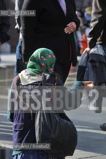 Venice october 2010 - Beggar and tourists in Venice with high tide turismo mendicante alta marea acqua alta ©Graziano Arici/Rosebud2