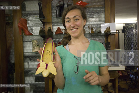 Shoemaker Daniela Ghezzo, in her shop in Venice with one of her creations ©Grazia Ippolito/Rosebud2