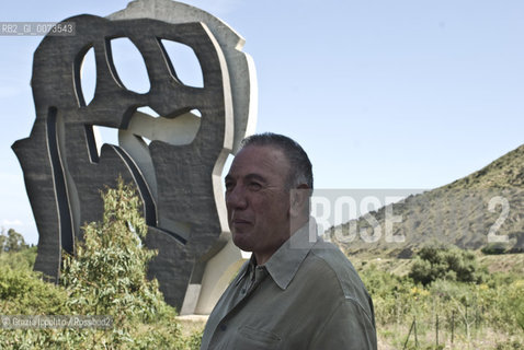 Antonio Presti, sicilian mecenate, founder of Fiumara dArte, at Castel di Tusa, Cefalù, Sicily, heres near Pietro Consagras work ©Grazia Ippolito/Rosebud2