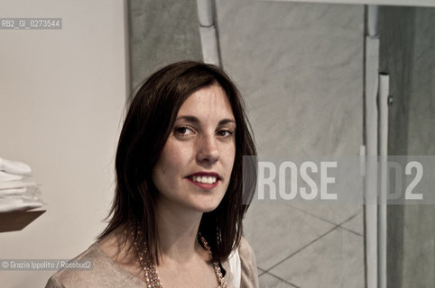 Rossella Farinotti, art critic and organizer of Arte in Sarpi in Milan, near a picture of Linda Carrara ©Grazia Ippolito/Rosebud2