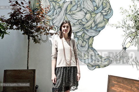 Rossella Farinotti, art critic and organizer of Arte in Sarpi in Milan, with a graffiti of Microbo, a woman painter ©Grazia Ippolito/Rosebud2